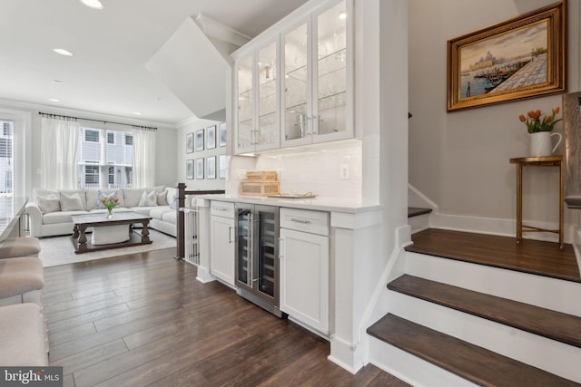 13126 Hawkeye Aly, Clarksburg, MD 20871 - indoor dry bar with beverage cooler, dark wood finished floors, recessed lighting, backsplash, and baseboards