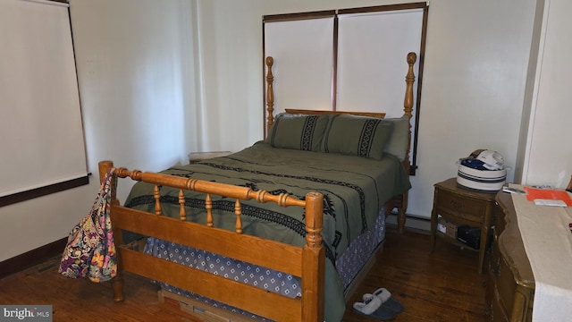2103 W Trindle Rd, Carlisle, PA 17013 - bedroom featuring wood-type flooring, baseboard heating, and baseboards