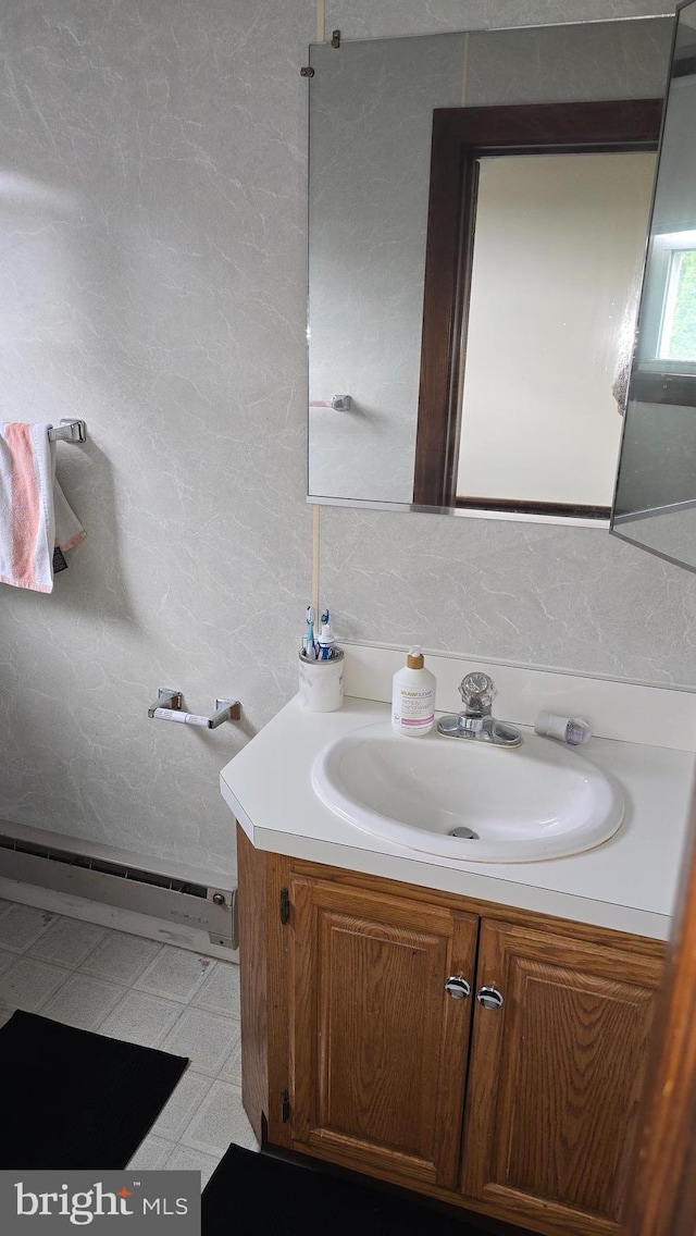 2103 W Trindle Rd, Carlisle, PA 17013 - bathroom featuring baseboard heating, vanity, and tile patterned floors