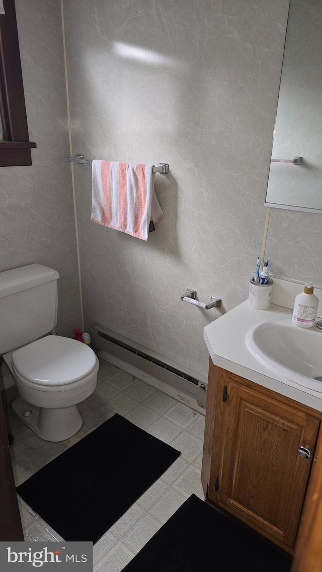 2103 W Trindle Rd, Carlisle, PA 17013 - bathroom featuring vanity, baseboard heating, toilet, and tile patterned floors