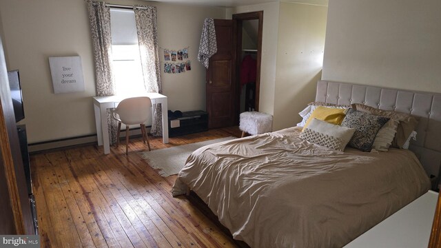 2103 W Trindle Rd, Carlisle, PA 17013 - bedroom featuring hardwood / wood-style floors and baseboard heating