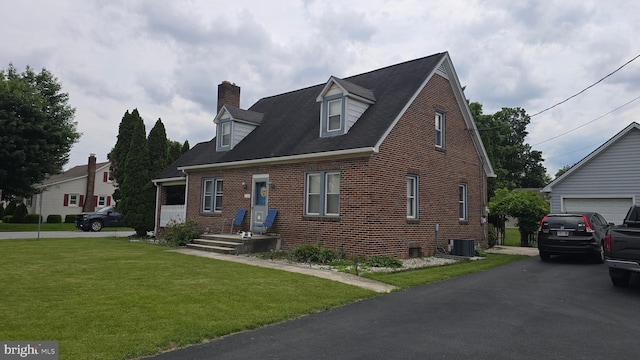 2103 W Trindle Rd, Carlisle, PA 17013 - new england style home featuring brick siding, a chimney, a front lawn, central air condition unit, and a garage
