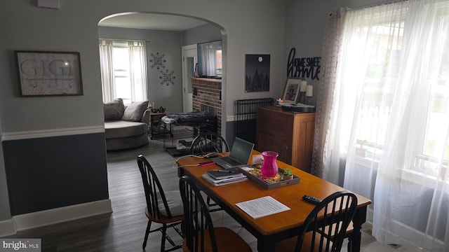 2103 W Trindle Rd, Carlisle, PA 17013 - dining area featuring arched walkways, wood finished floors, and baseboards