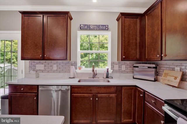 182 Mohegan Dr, Havre De Grace, MD 21078 - kitchen with stainless steel dishwasher, a sink, backsplash, crown molding, and light countertops