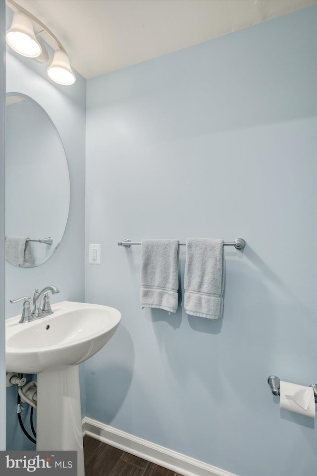 182 Mohegan Dr, Havre De Grace, MD 21078 - bathroom featuring wood finished floors, baseboards, and a sink