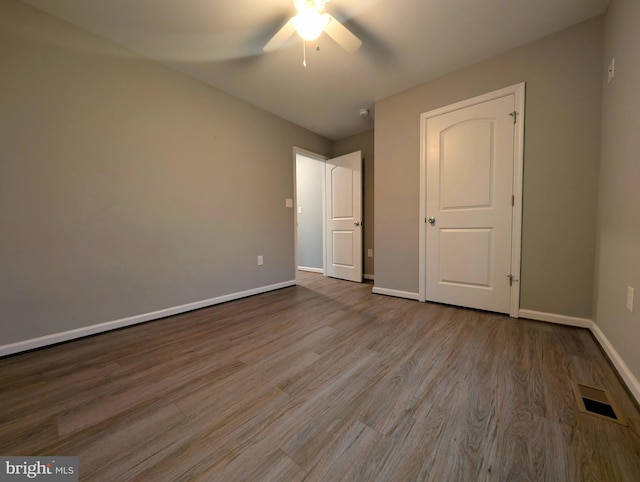 87 Tulip Poplar Dr, Linden, VA 22642 - unfurnished bedroom featuring baseboards, wood finished floors, and a ceiling fan