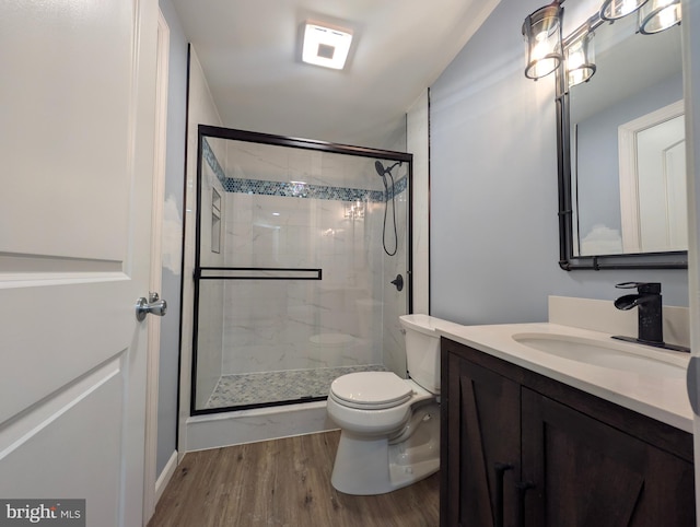87 Tulip Poplar Dr, Linden, VA 22642 - bathroom with vanity, wood finished floors, toilet, and a stall shower