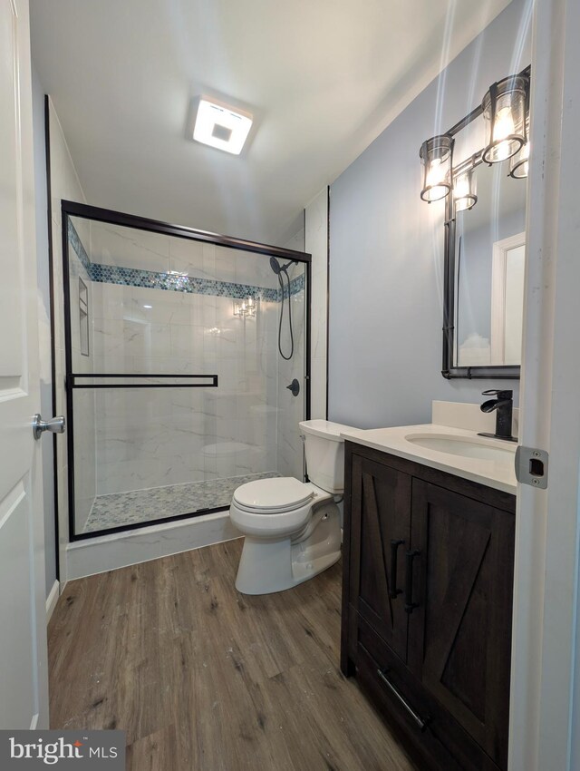 87 Tulip Poplar Dr, Linden, VA 22642 - full bath with wood finished floors, toilet, vanity, and a shower stall