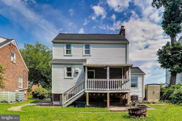5016 56th Ave, Hyattsville, MD 20781 - rear view of house with a deck, an outdoor fire pit, a shed, stairs, and a chimney