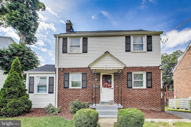 5016 56th Ave, Hyattsville, MD 20781 - view of front of property featuring a chimney and brick siding