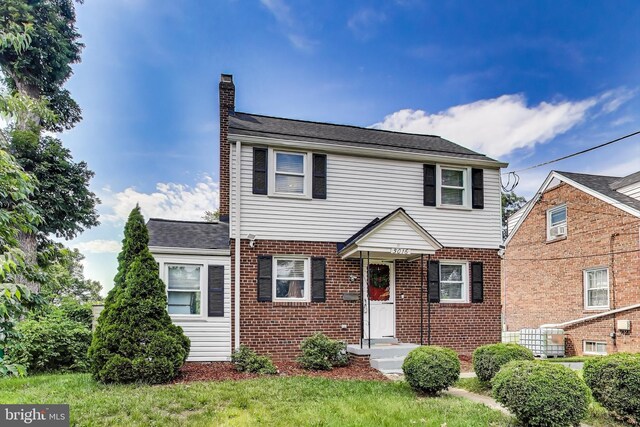 5016 56th Ave, Hyattsville, MD 20781 - view of front of house featuring a chimney and brick siding