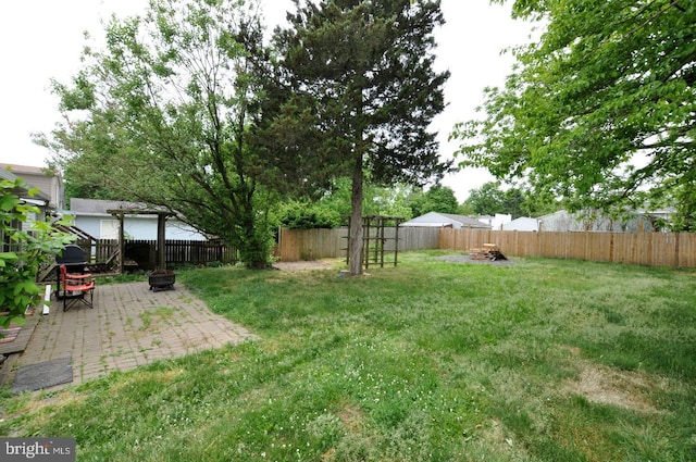 81 Jarvis St, Pemberton, NJ 08068 - view of yard featuring an outdoor fire pit and a patio area