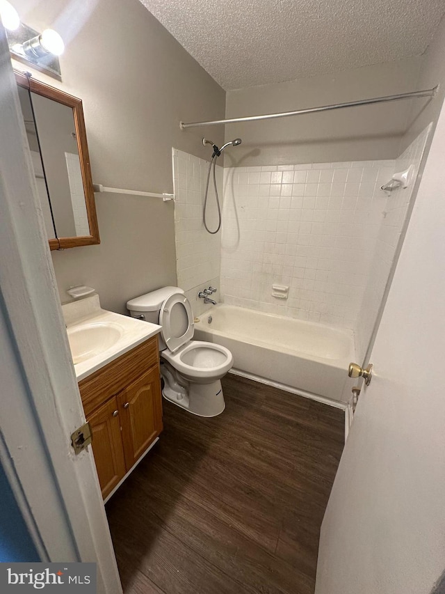 7980 Audubon Ave Unit C3, Alexandria, VA 22306 - bathroom with shower / tub combination, wood finished floors, a textured ceiling, toilet, and vanity