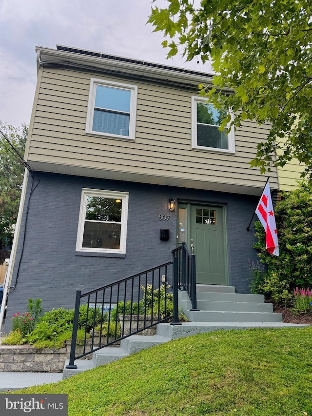 807 Delafield St NE, Washington, DC 20017 - view of front of house featuring brick siding and a front lawn