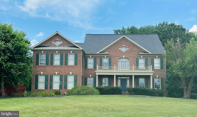 14494 Chamberry Cir, Haymarket, VA 20169 - colonial house with a front lawn, brick siding, and a balcony