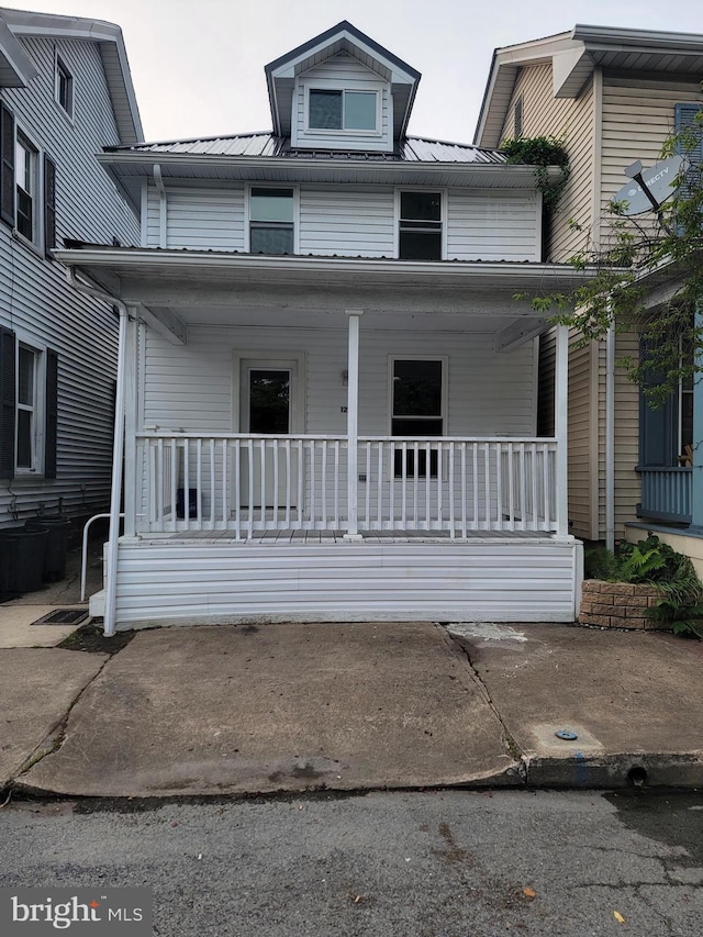 128 W Main St, New Bloomfield, PA 17068 - view of front of home featuring covered porch and metal roof