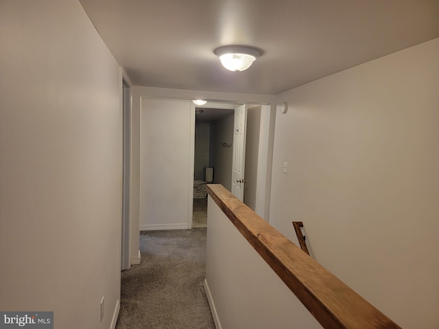 128 W Main St, New Bloomfield, PA 17068 - hall featuring an upstairs landing, dark carpet, and baseboards