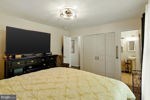 6548 10th St, Chesapeake Beach, MD 20732 - bedroom featuring a closet, ensuite bath, and baseboards