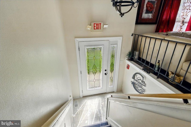 6548 10th St, Chesapeake Beach, MD 20732 - foyer with plenty of natural light and a chandelier