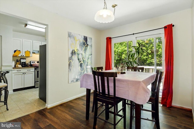 6548 10th St, Chesapeake Beach, MD 20732 - dining space with baseboards and wood finished floors
