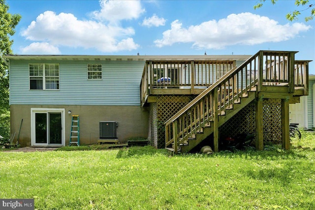 6548 10th St, Chesapeake Beach, MD 20732 - back of property with stairway, a deck, central AC, a yard, and stucco siding
