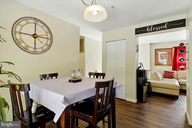 6548 10th St, Chesapeake Beach, MD 20732 - dining room with dark wood-style flooring and baseboards