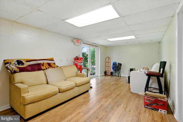 6548 10th St, Chesapeake Beach, MD 20732 - living room with a drop ceiling, wood finished floors, and baseboards