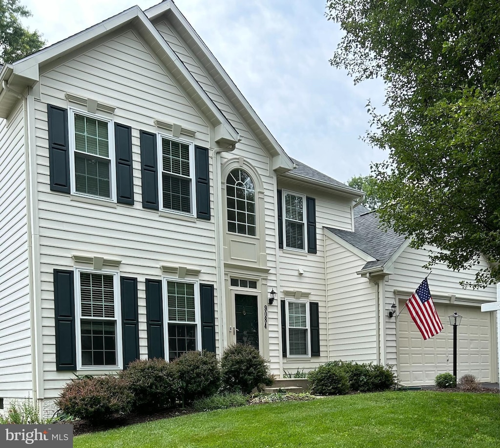 9084 Clendenin Way, Frederick, MD 21704 - view of front facade with a front yard, a shingled roof, and an attached garage