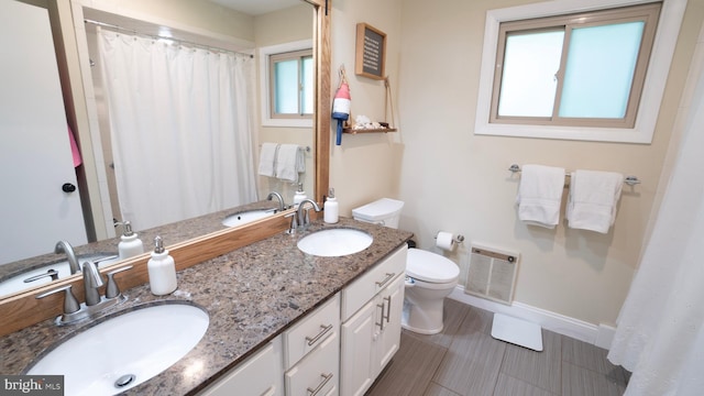 3809 Carriage House Dr, Camp Hill, PA 17011 - full bath with double vanity, a shower with curtain, and heating unit