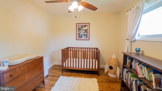 3809 Carriage House Dr, Camp Hill, PA 17011 - bedroom featuring wood finished floors, ceiling fan, and a crib