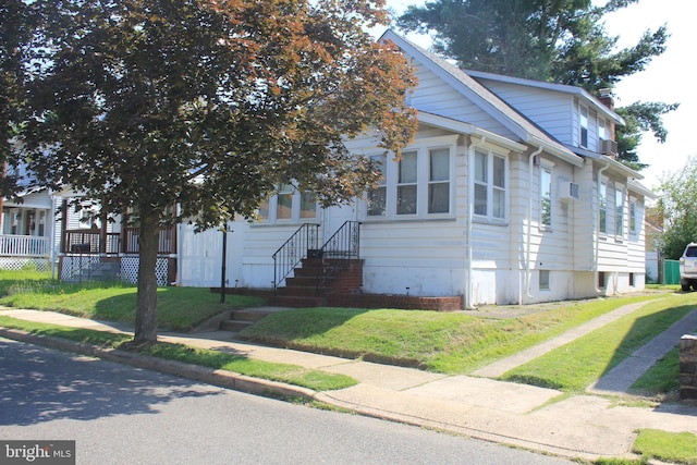34 Andrew St, Hamilton, NJ 08610 - view of front of house featuring a front yard and entry steps