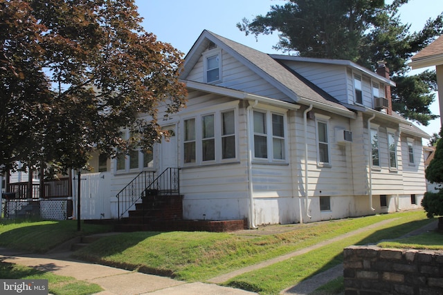 34 Andrew St, Hamilton, NJ 08610 - view of property exterior with a yard and roof with shingles