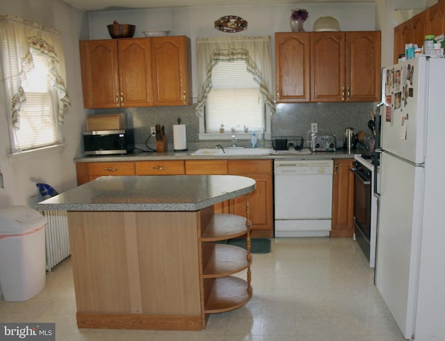 34 Andrew St, Hamilton, NJ 08610 - kitchen with white appliances, healthy amount of natural light, and tasteful backsplash