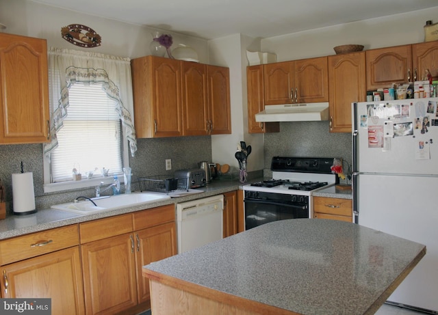 34 Andrew St, Hamilton, NJ 08610 - kitchen featuring white appliances, under cabinet range hood, decorative backsplash, a kitchen island, and brown cabinetry