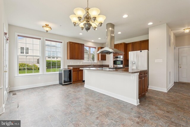 24 Tocati St, Thurmont, MD 21788 - kitchen featuring island range hood, stainless steel appliances, a chandelier, beverage cooler, and hanging light fixtures