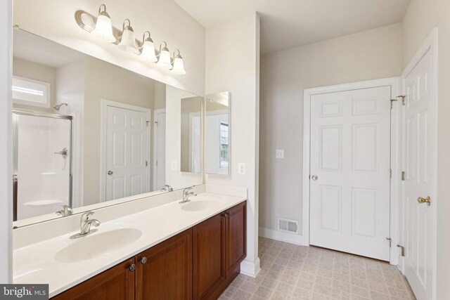 24 Tocati St, Thurmont, MD 21788 - full bathroom with double vanity and an enclosed shower