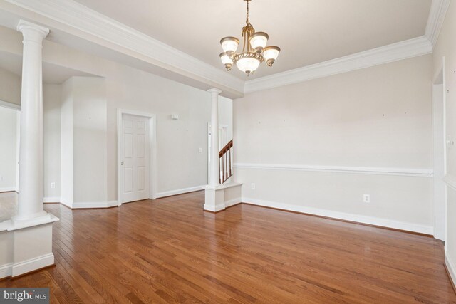 24 Tocati St, Thurmont, MD 21788 - unfurnished room featuring wood finished floors, crown molding, a chandelier, and ornate columns