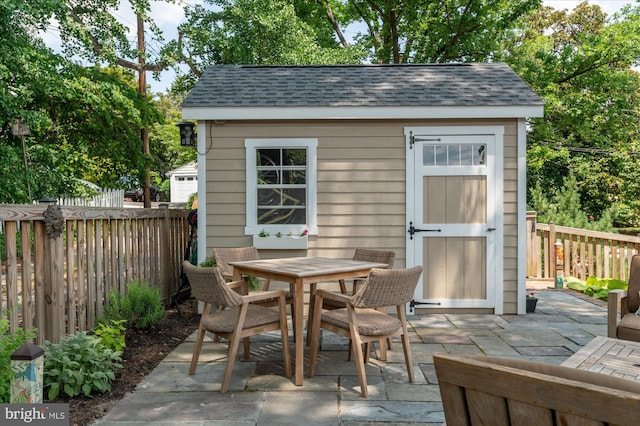 200 W Monroe Ave, Alexandria, VA 22301 - fenced backyard with a patio area and outdoor dining area