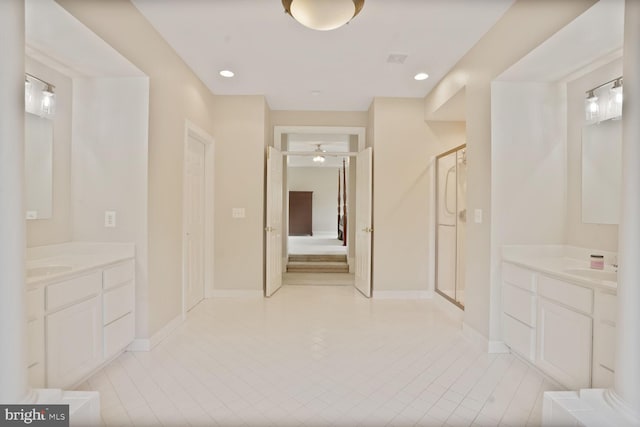 5438 Sherman Oaks Ct, Haymarket, VA 20169 - bathroom with ceiling fan, a shower stall, two vanities, tile patterned flooring, and recessed lighting
