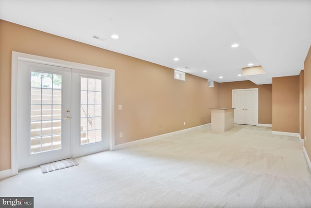 5438 Sherman Oaks Ct, Haymarket, VA 20169 - unfurnished living room with light colored carpet, french doors, and recessed lighting