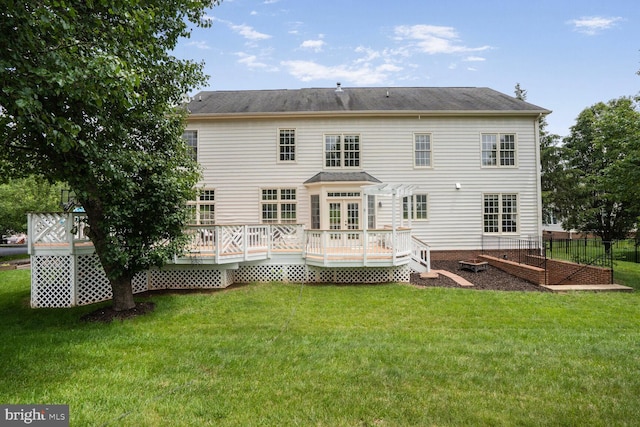 5438 Sherman Oaks Ct, Haymarket, VA 20169 - rear view of house with a lawn, a deck, and a garden