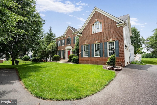 5438 Sherman Oaks Ct, Haymarket, VA 20169 - view of front of property with brick siding and a front yard