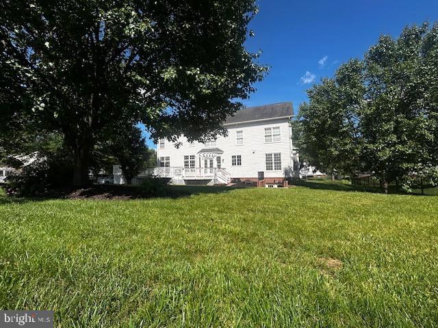 5438 Sherman Oaks Ct, Haymarket, VA 20169 - view of green lawn featuring a deck