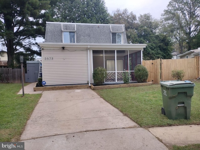 2573 Paxton St, Woodbridge, VA 22192 - view of front of property with mansard roof, roof with shingles, a sunroom, and driveway