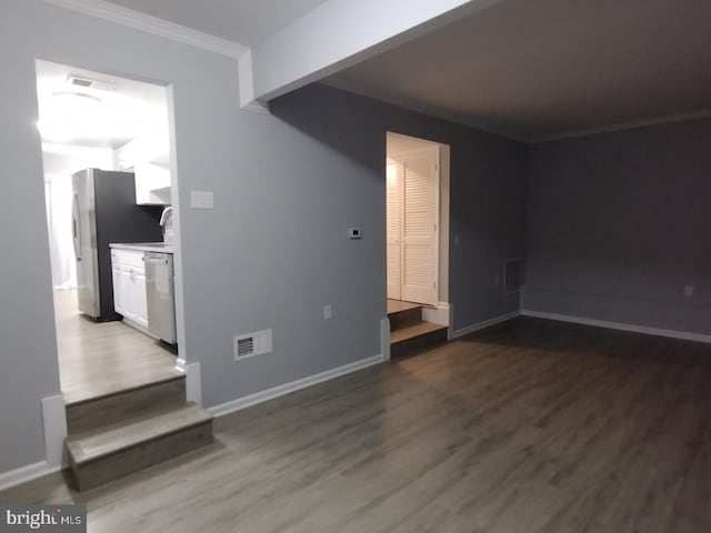 2573 Paxton St, Woodbridge, VA 22192 - unfurnished room featuring dark wood-style floors, ornamental molding, and baseboards