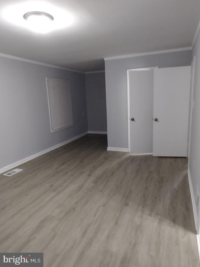 2573 Paxton St, Woodbridge, VA 22192 - empty room featuring ornamental molding, wood finished floors, and baseboards
