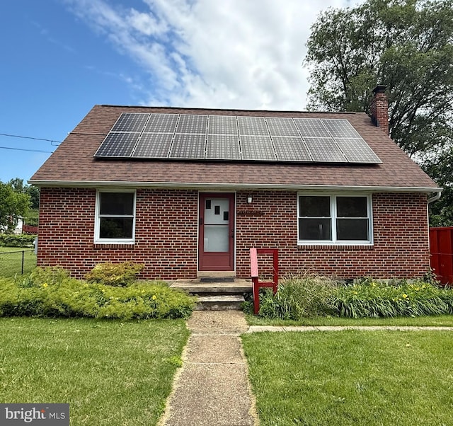5902 Harford Ave, Gwynn Oak, MD 21207 - view of front of property with roof mounted solar panels, roof with shingles, a chimney, and brick siding