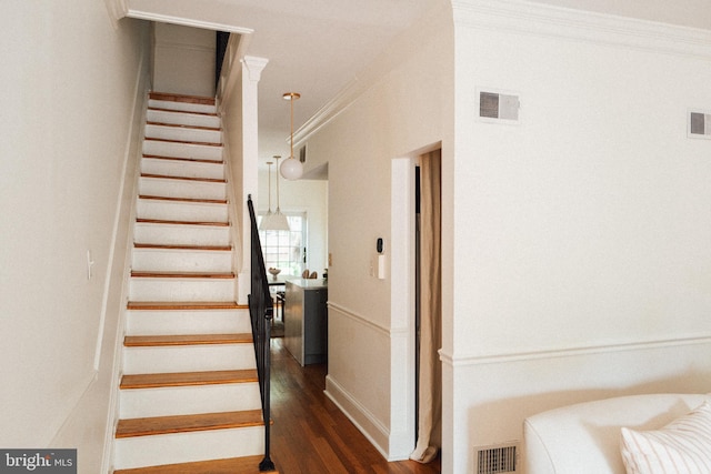 708 9th St SE, Washington, DC 20003 - staircase with wood finished floors and crown molding