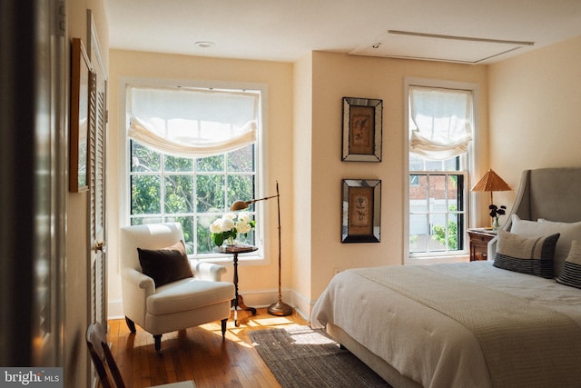 708 9th St SE, Washington, DC 20003 - bedroom featuring multiple windows, hardwood / wood-style flooring, and baseboards