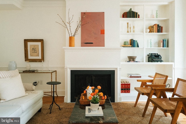 708 9th St SE, Washington, DC 20003 - living area with a fireplace, built in features, wood finished floors, and ornamental molding